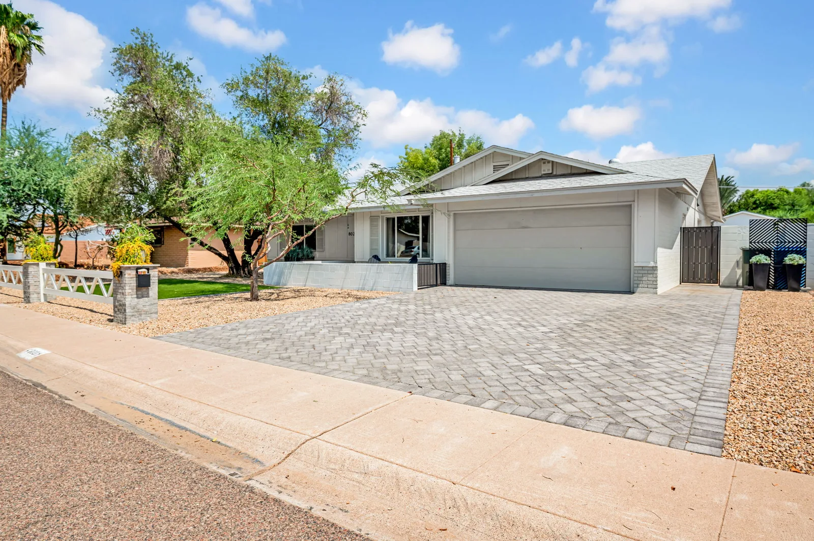 Paver driveway and garage on a remodeled Phoenix ranch.